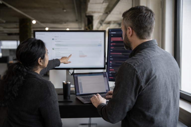 Engineers reviewing vulnerability scan results in CI/CD pipeline