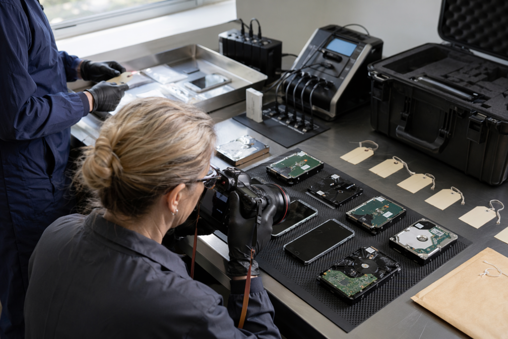 Forensic analyst examining drive images for cyber essentials checklist evidence