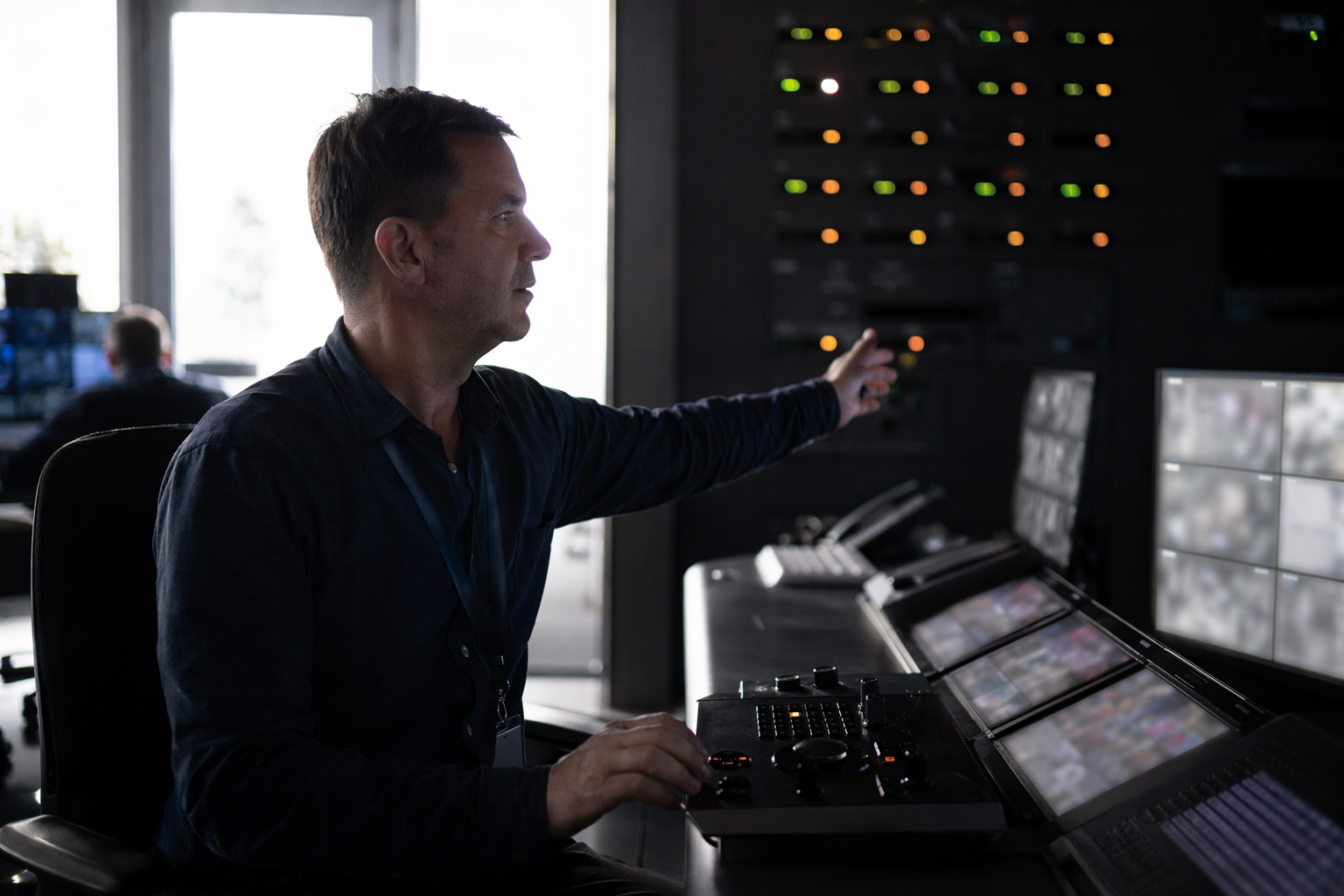 Operator monitoring abstracted camera feeds near data centre entry controls