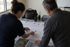 Operations lead arranging recovery runbook, illustrating iso 27001 controls