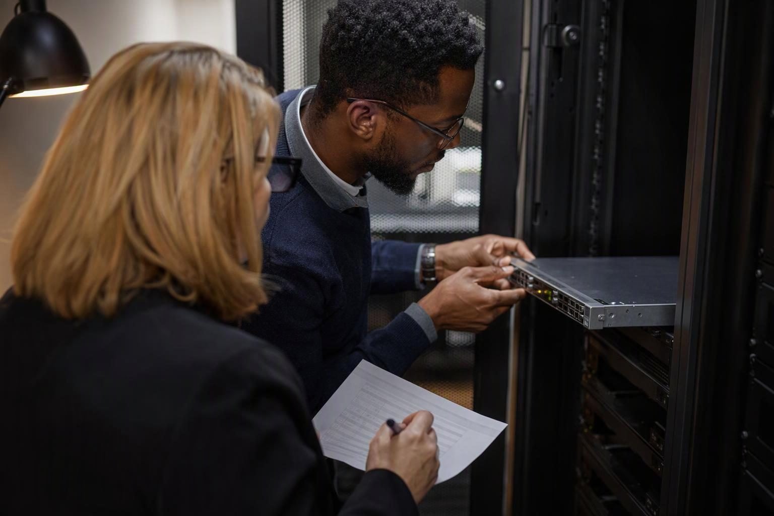 Operations and IT staff review a new office device