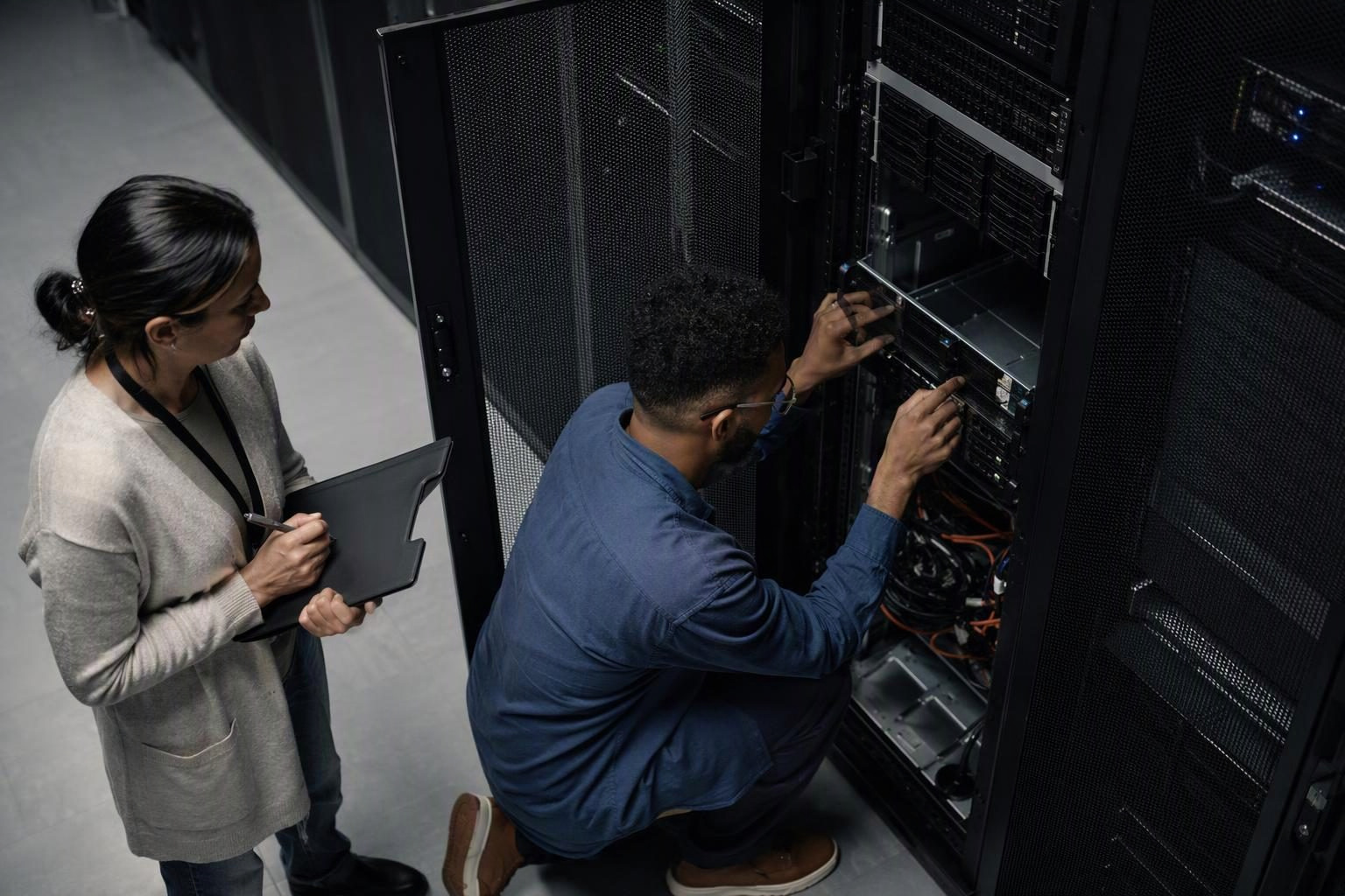 IT engineers checking equipment in a university data centre
