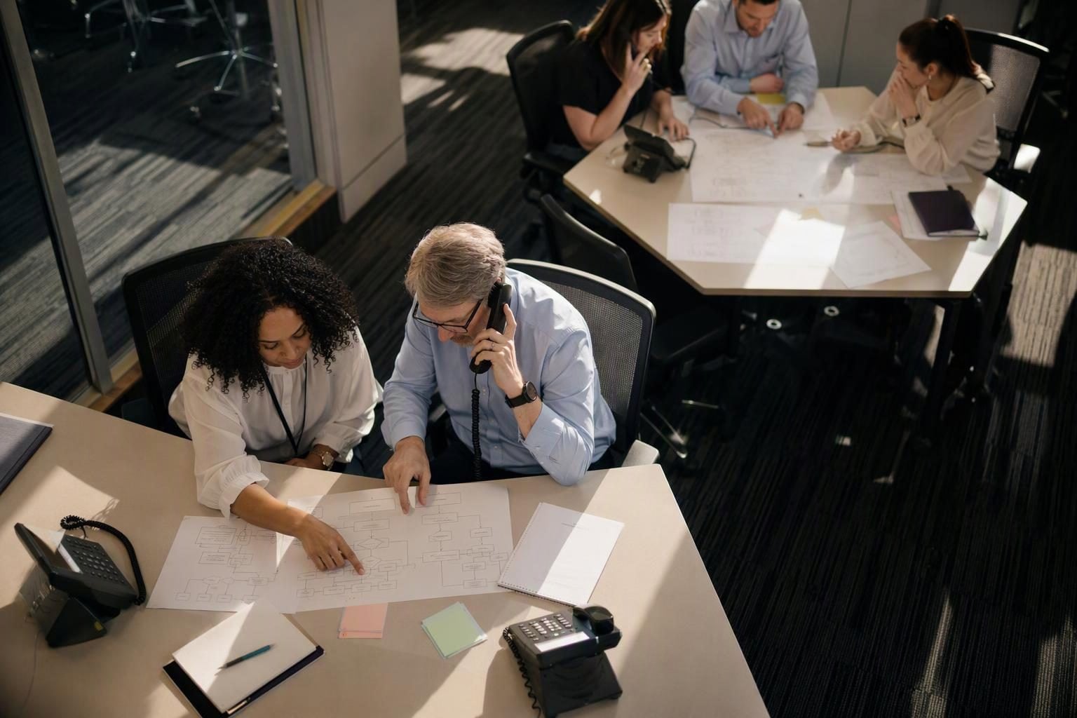 Financial services teams coordinating a disruption exercise by phone